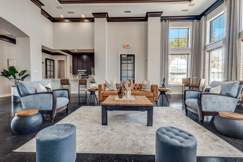 a living room with couches and chairs and a coffee table